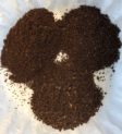 Small mounds of ground coffee.